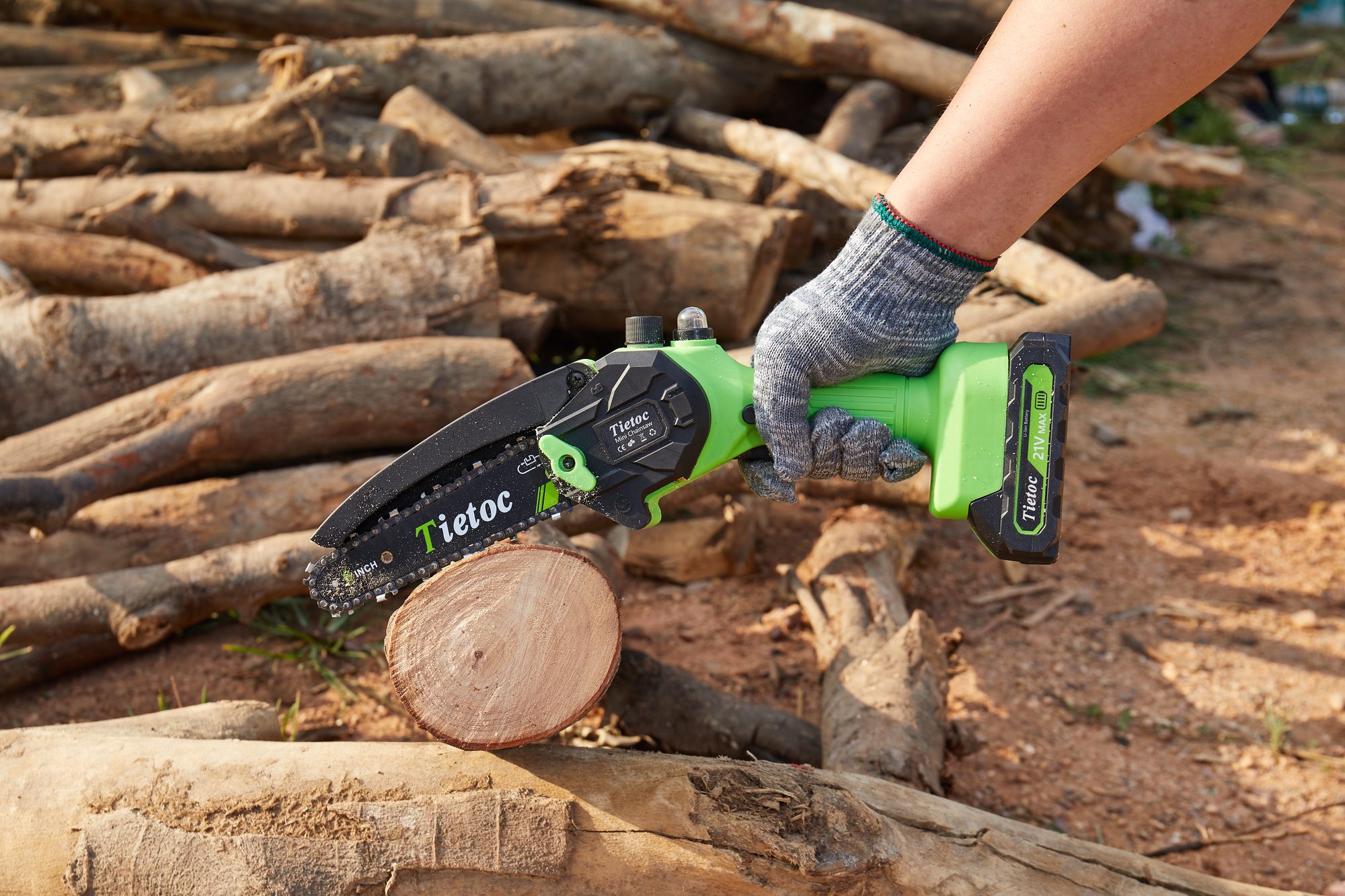 Tietoc 6-inch mini chainsaw cutting through a log